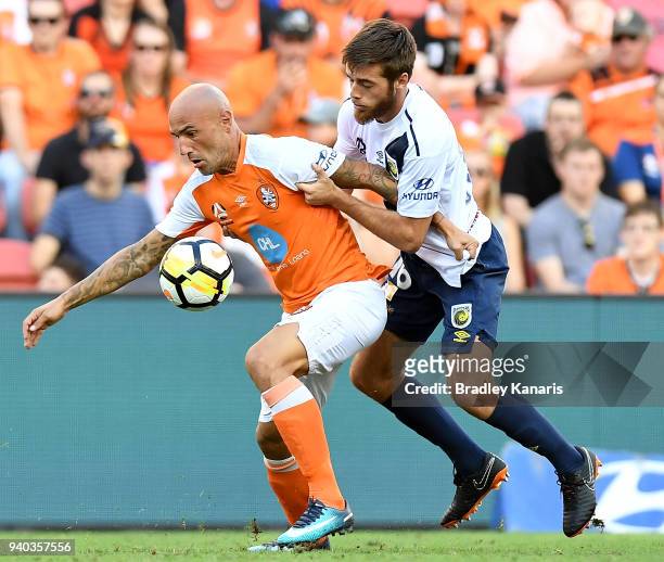 Massimo Maccarone of the Roar is pressured by the defence during the round 25 A-League match between the Brisbane Roar and the Central Coast Mariners...