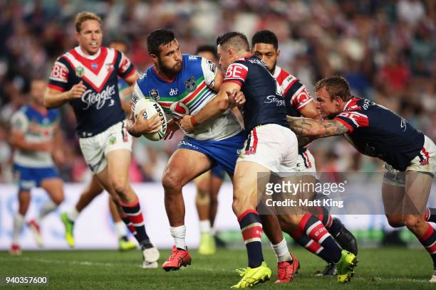 Peta Hiku of the Warriors is tackled during the round four NRL match between the Sydney Roosters and the New Zealand Warriors at Allianz Stadium on...