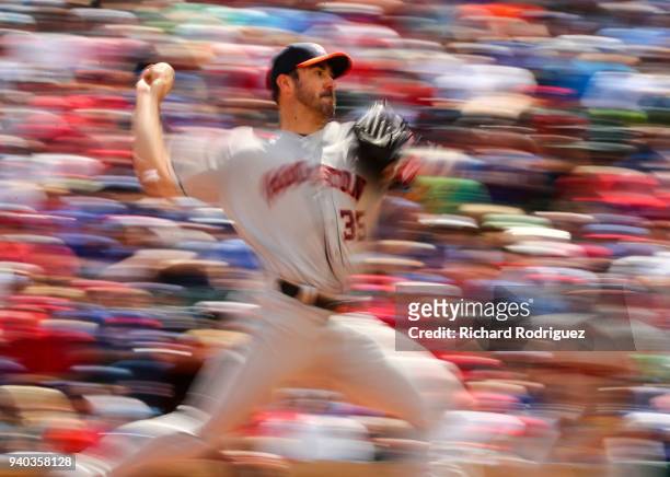 Justin Verlander of the Houston Astros pitches in the third inning against the Texas Rangers on Opening Day at Globe Life Park in Arlington on March...