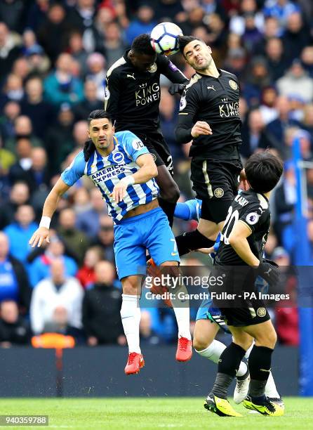 Leicester City's Wilfred Ndidi and team-mate Vicente Iborra battle for the ball with Brighton & Hove Albion's Beram Kayal during the Premier League...