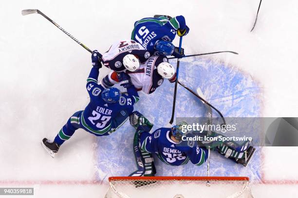 Vancouver Canucks Goalie Thatcher Demko makes a save on Columbus Blue Jackets left wing Matt Calvert during their NHL game at Rogers Arena on March...