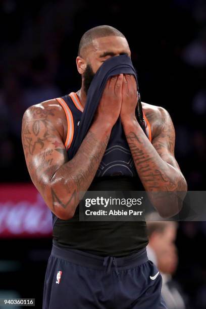 Kyle O'Quinn of the New York Knicks reacts in the final minutes of play in the fourth quarter against the Detroit Pistons during their game at...