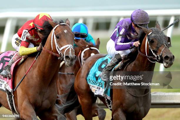 Audible, riden by John Valesquez, battles Catholic Boy, riden by Irad Ortiz Jr, out of turn four during the Florida Derby at Gulfstream Park on March...