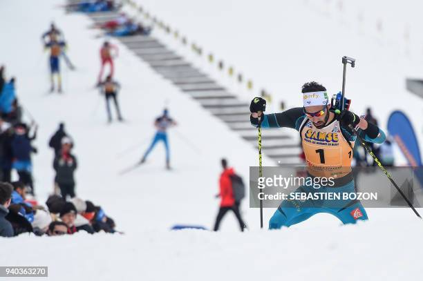 France's Martin Fourcade competes during the mass start Premanon French Biathlon Championships on March 31, 2018 in Premanon. / AFP PHOTO / SEBASTIEN...