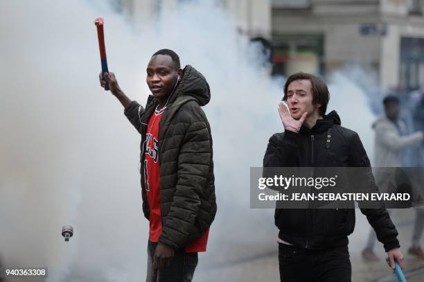 Protesters face riot police while members of associations, unions and collectives, supporting migrants but also occupants of the ZAD of...