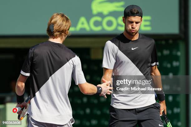 Karen Khachanov and Andrey Rublev of Russia celebrate after a point against Bob Bryan and Mike Bryan of the United States during the men's doubles...