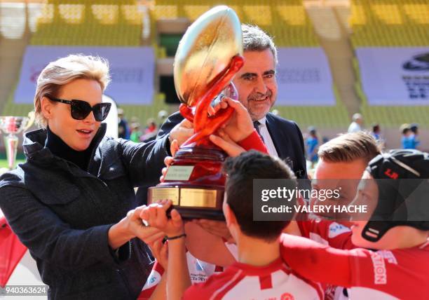 Princess Charlene of Monaco attends the International Rugby tournament Tournoi Sainte Devote at the Louis II Stadium in Monaco on March 31, 2018. /...