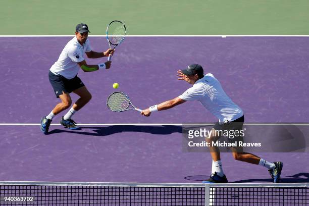 Bob Bryan of the United States returns a shot against Karen Khachanov and Andrey Rublev of Russia while playing with Mike Bryan of the United States...