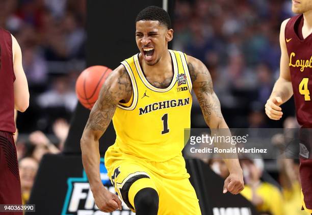 Charles Matthews of the Michigan Wolverines reacts after a basket in the second half against the Loyola Ramblers during the 2018 NCAA Men's Final...