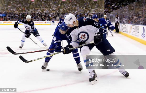 March 31 In the first period, Toronto Maple Leafs right wing Connor Brown and Winnipeg Jets defenseman Tyler Myers battle for the puck. The Toronto...