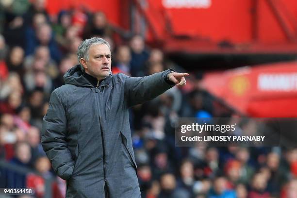 Manchester United's Portuguese manager Jose Mourinho gestures during the English Premier League football match between Manchester United and Swansea...