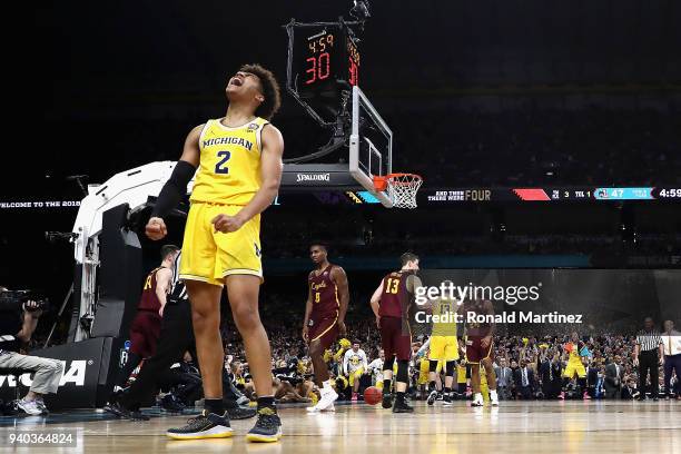 Jordan Poole of the Michigan Wolverines reacts in the second half against the Loyola Ramblers during the 2018 NCAA Men's Final Four Semifinal at the...