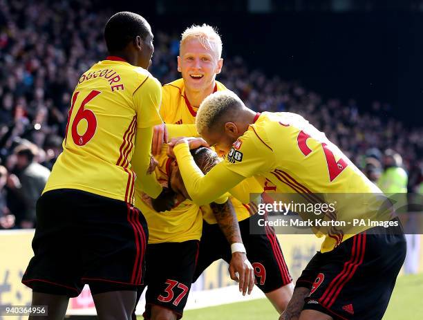 Watford's Roberto Pereyra celebrates scoring his side's second goal of the game with team-mates including Will Hughes , Abdoulaye Doucoure and...