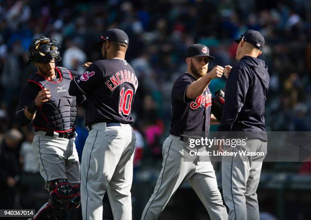 Cody Allen of the Cleveland Indians, second from right, is congratulated by teammates after securing the win against the Seattle Mariners at Safeco...