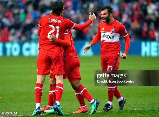 Chicago Fire forward Nemanja Nikolic reacts with Chicago Fire Alan Gordon after Chicago Fire defender Brandon Vincent scored a goal with a header...