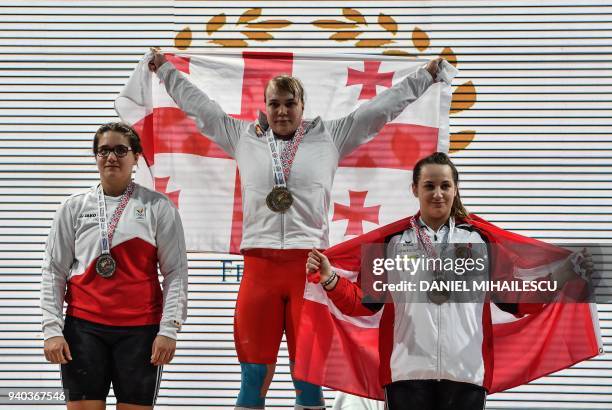 Gold medalist Anastasiia Hotfrid of Georgia, Silver medalist Anna Vanbellinghen of Belgium and Bronze medalist Sarah Fischer of Austria celebrate...