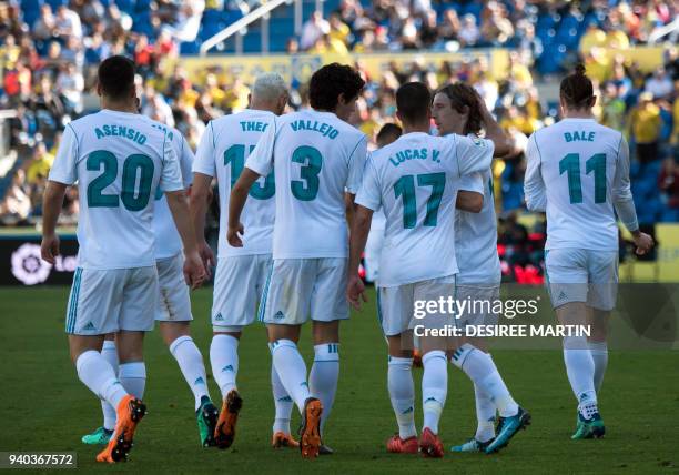 Real Madrid players celebrate a goal during the Spanish League football match between UD Las Palmas and Real Madrid CF at the Gran Canaria stadium in...