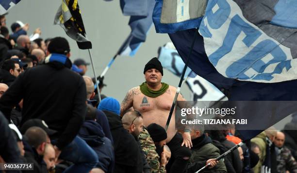 Napoli's supporters cheer during the Italian Serie A football match Sassuolo vs Napoli at Mapei Stadium in Reggio Emilia on March 31, 2018. / AFP...