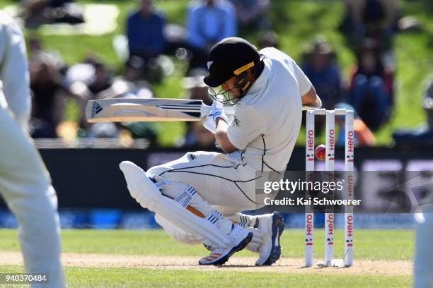 Neil Wagner of New Zealand gets hit on the head by a ball during day three of the Second Test match between New Zealand and England at Hagley Oval on...