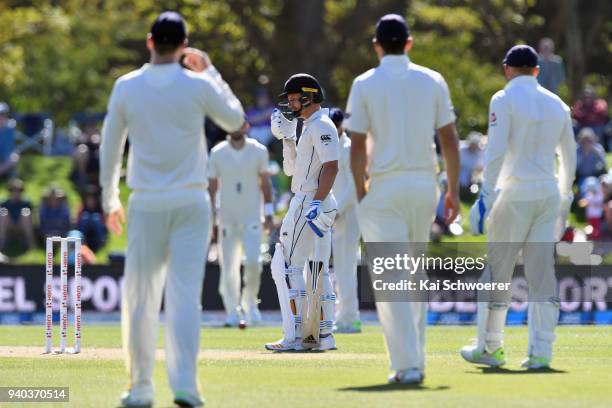 Neil Wagner of New Zealand reacts after he got hit on the head by a ball during day three of the Second Test match between New Zealand and England at...