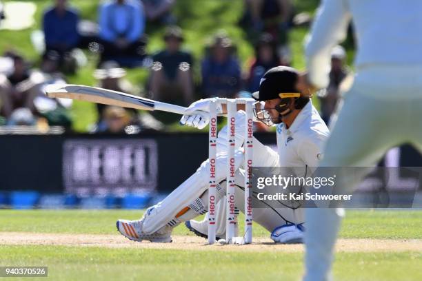 Neil Wagner of New Zealand gets hit on the head by a ball during day three of the Second Test match between New Zealand and England at Hagley Oval on...