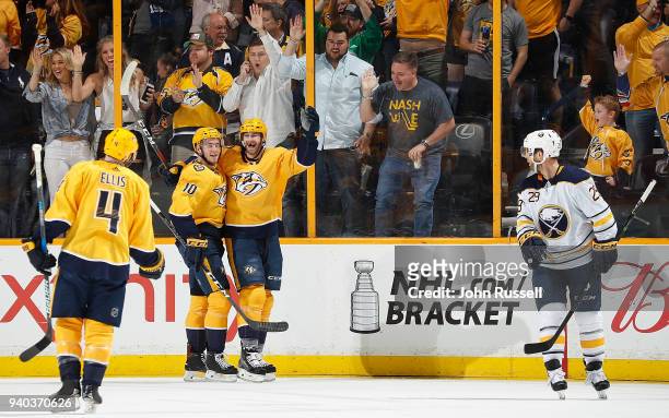 Austin Watson celebrates his goal with Colton Sissons of the Nashville Predators against the Buffalo Sabres during an NHL game at Bridgestone Arena...