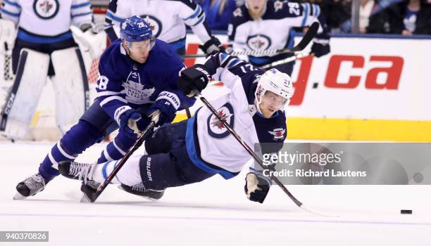 March 31 In the second period, Winnipeg Jets left wing Nikolaj Ehlers goes down with Toronto Maple Leafs right wing Connor Brown on top as they...