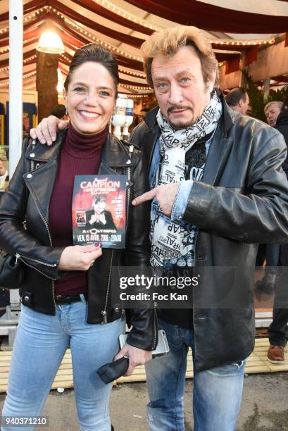 Johnny Hallyday look alike singer Richy and singer Singrid CampionÊattend the Foire du Trone Opening At Pelouse de Reuilly on March 30, 2018 in...