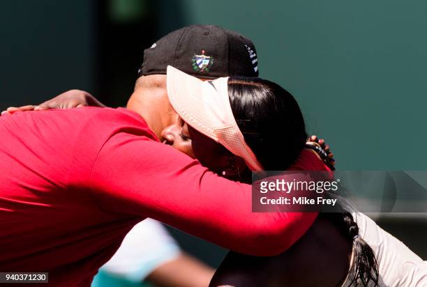 Sloane Stephens of the USA hugs coach Kamau Murray after beating Jelena Ostapenko of Latvia 7-5 6-1 in the women's final on Day 13 of the Miami Open...