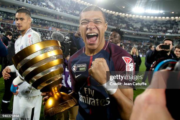 Kylian Mbappe of PSG celebrates the victory following the French League Cup final between Paris Saint-Germain and AS Monaco on March 31, 2018 in...