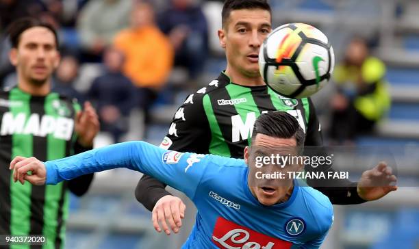 Napoli's Spanish striker Jose Maria Callejon fights for the ball with Spal's Italian defender Michele Cremonesi during the Italian Serie A football...