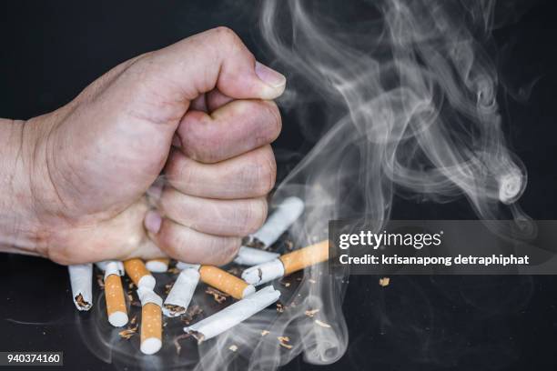 quit smoking because cigarettes are harmful to health. - anti smoking stock pictures, royalty-free photos & images