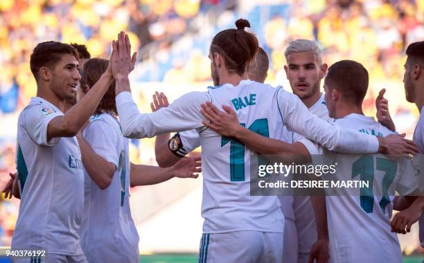 Real Madrid's Welsh forward Gareth Bale celebrates a goal with teammates during the Spanish League football match between UD Las Palmas and Real...