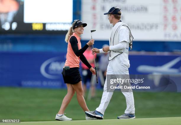 Pernilla Lindberg of Sweden is all smiles with caddia fiancee Daniel Taylor after her birdie on 18 secured her a three shot lead heading into the...