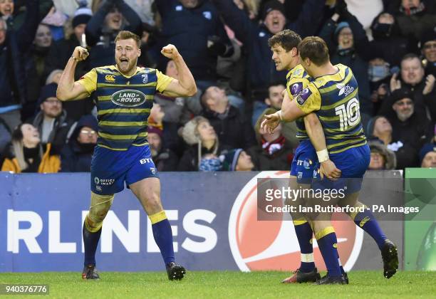 Cardiff players Owen Lane, Lloyd Williams, and Jarrod Evans celebrate after the final whistle after winning by 20-6 during the Challenge Cup, Quarter...