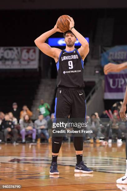 Byron Mullens of the Lakeland Magic passes the ball against the Erie BayHawks during Round One of the NBA G-League playoffs on March 31, 2018 at Erie...