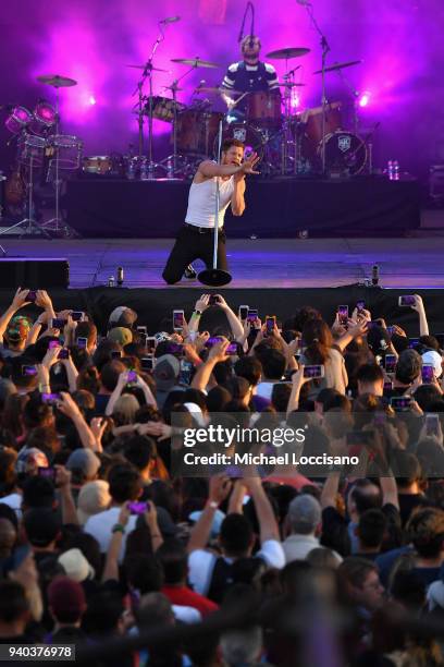 Singer Dan Reynolds and drummer Daniel Platzman perform onstage during Coca-Cola Music at the NCAA March Madness Music Festival at Hemisfair on March...