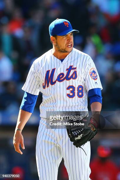 Anthony Swarzak reacts after the thitd out of the seventh inning against the St. Louis Cardinals at Citi Field on March 31, 2018 in the Flushing...