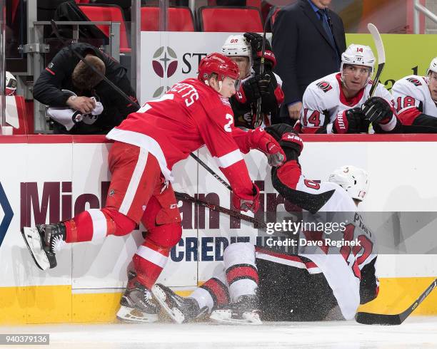 Joe Hicketts of the Detroit Red Wings battles along the boards with Tom Pyatt of the Ottawa Senators during an NHL game at Little Caesars Arena on...