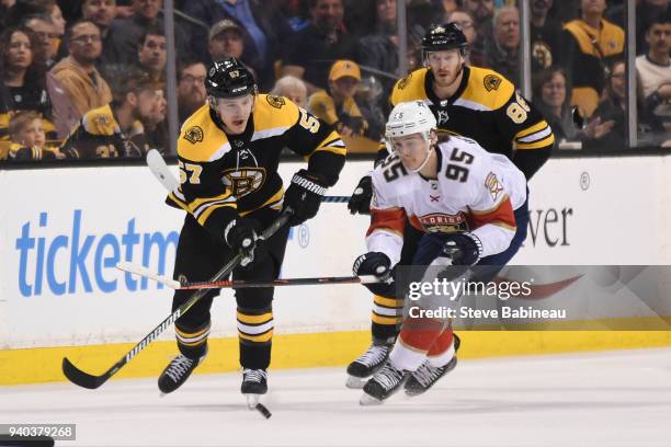 Tommy Wingels of the Boston Bruins skates against Henrik Borgstrom of the Florida Panthers at the TD Garden on March 31, 2018 in Boston,...