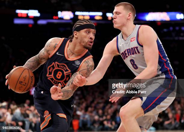 Kyle O'Quinn of the New York Knicks dribbles against Henry Ellenson of the Detroit Pistons in the fourth quarter during their game at Madison Square...
