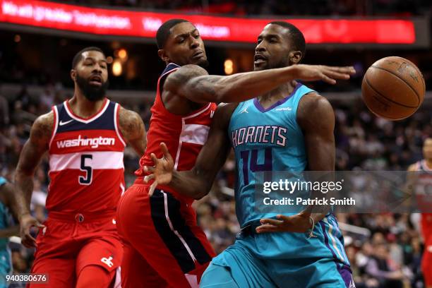 Bradley Beal of the Washington Wizards steals the ball from Michael Kidd-Gilchrist of the Charlotte Hornets during the first half at Capital One...