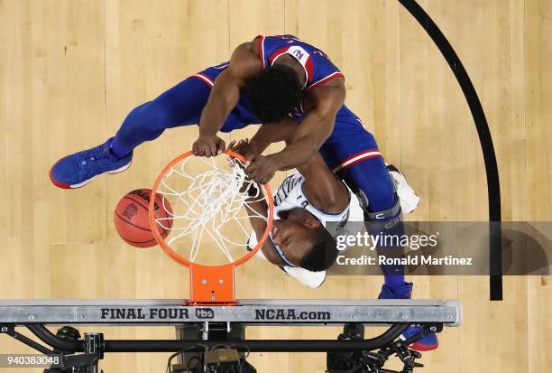 Udoka Azubuike of the Kansas Jayhawks dunks against Dhamir Cosby-Roundtree of the Villanova Wildcats in the first half during the 2018 NCAA Men's...