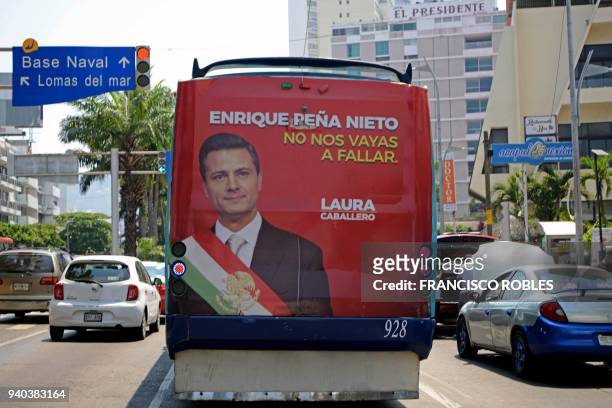 View of a banner on a bus with the image of Mexican President Enrique Pena Nieto, with a legend that reads "Do not let us fail" in Acapulco resort...