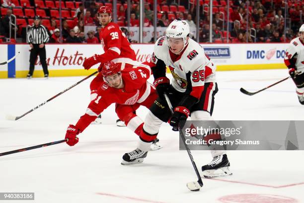 Matt Duchene of the Ottawa Senators looks for a shot in front of Dylan Larkin of the Detroit Red Wings during the third period at Little Caesars...