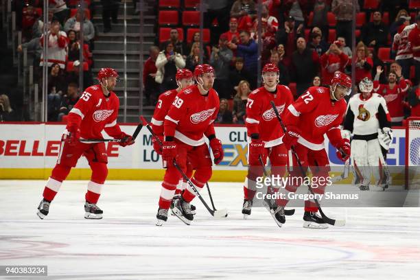Andreas Athanasiou of the Detroit Red Wings celebrates his third period goal with teammates in front of Mike Condon of the Ottawa Senators at Little...