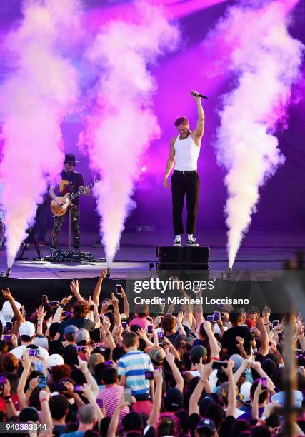 Keyboard/bassist Ben McKee, singer Dan Reynolds and drummer Daniel Platzman perform onstage during Coca-Cola Music at the NCAA March Madness Music...