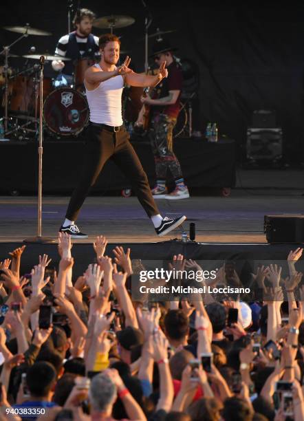 Keyboard/bassist Ben McKee, singer Dan Reynolds and drummer Daniel Platzman perform onstage during Coca-Cola Music at the NCAA March Madness Music...