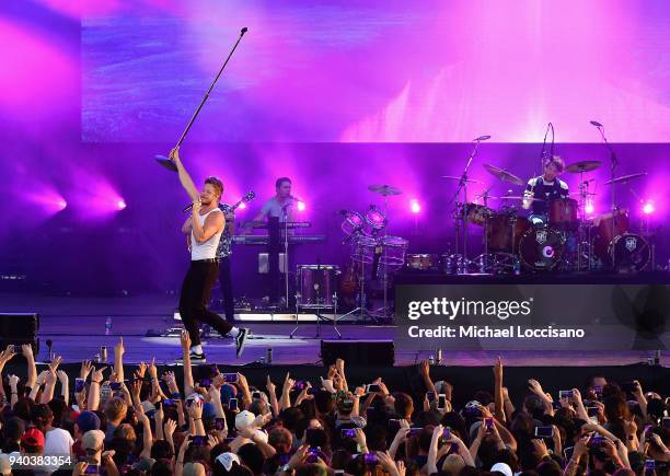 Singer Dan Reynolds and drummer Daniel Platzman of Imagine Dragons perform onstage during Coca-Cola Music at the NCAA March Madness Music Festival at...