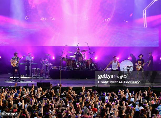 Lead guitarist Wayne Sermon, drummer Daniel Platzman, singer Dan Reynolds and keyboard/bassist Ben McKee of Imagine Dragons perform onstage during...